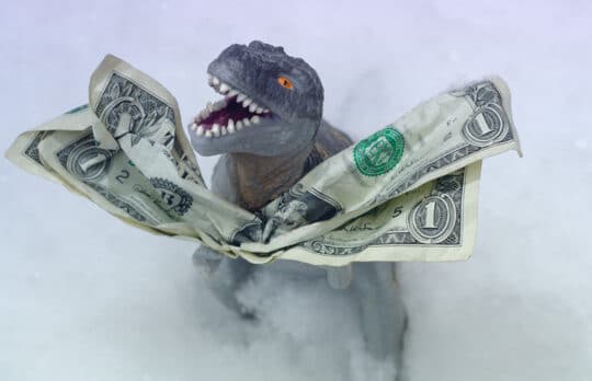 dinosaur financial beast with dollar bill
